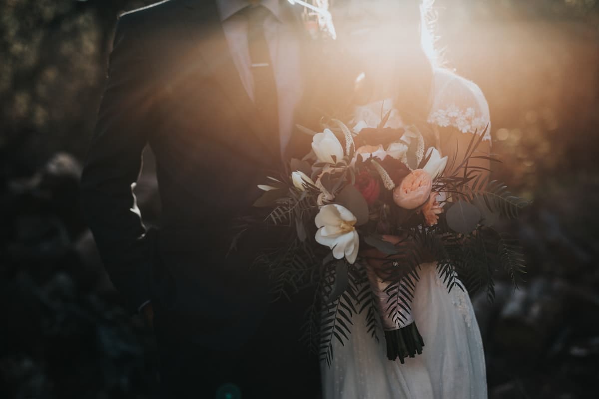 Bride and groom laughing together at their wedding reception